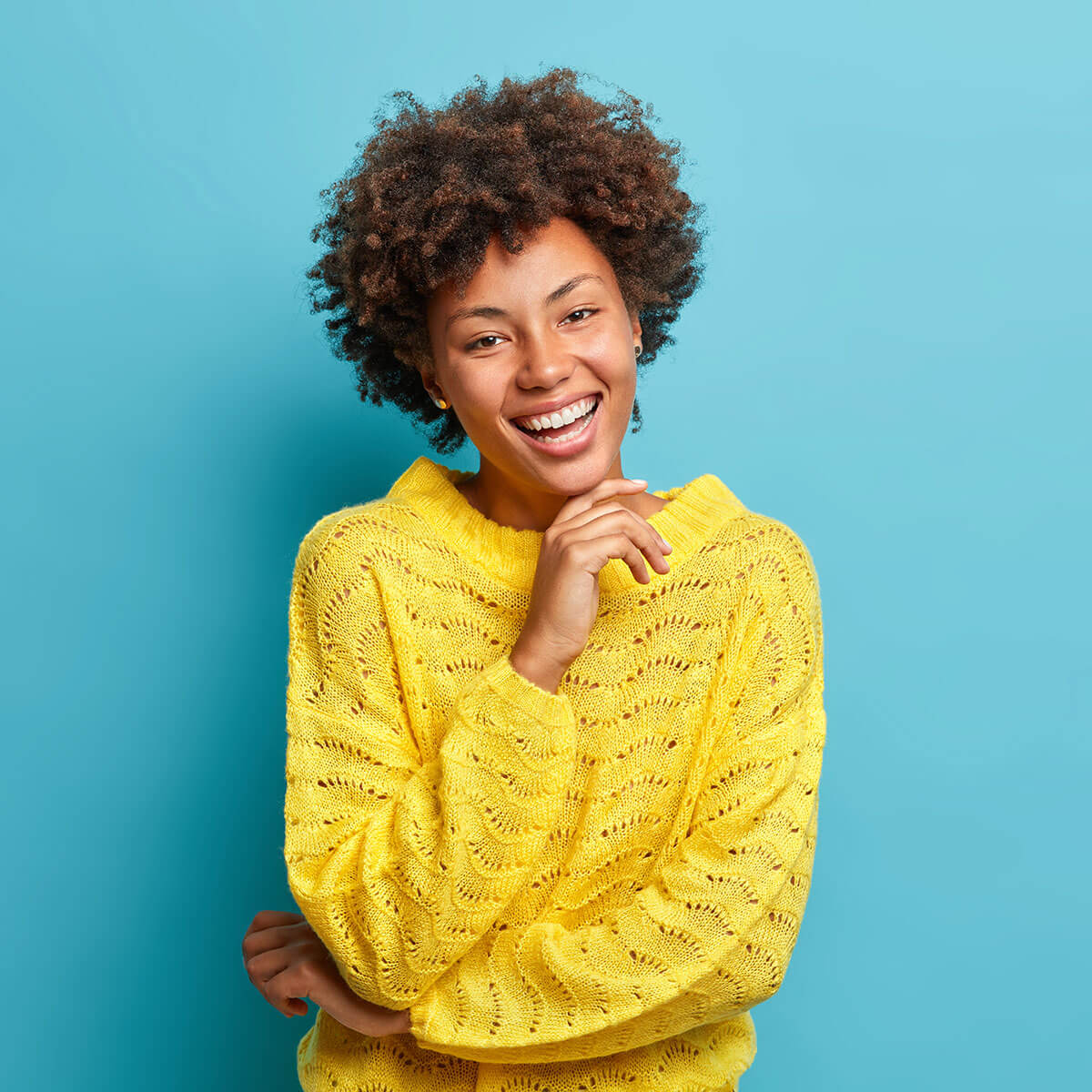 successful-happy-dark-skinned-curly-woman-smiles-ZJ7BLHR.jpg
